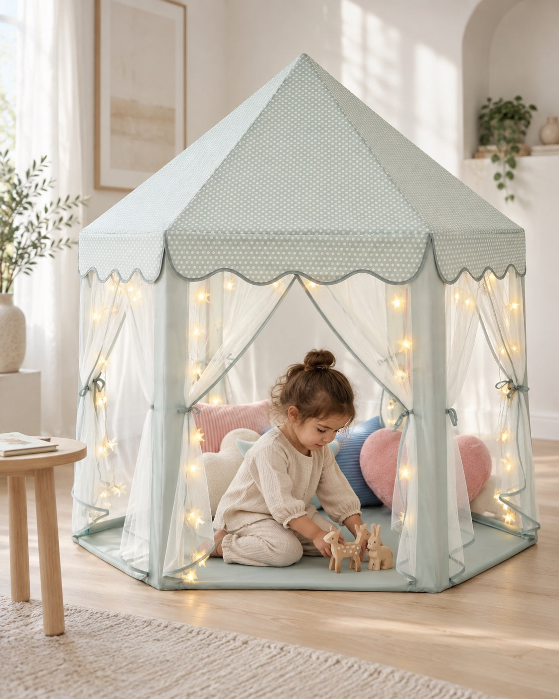 A child playing inside the celadon MonoBeach princess tent